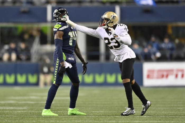 New Orleans Saints cornerback Marshon Lattimore (23) shoves Seattle Seahawks wide receiver DK Metcalf (14). Mandatory Credit: Steven Bisig-USA TODAY Sports